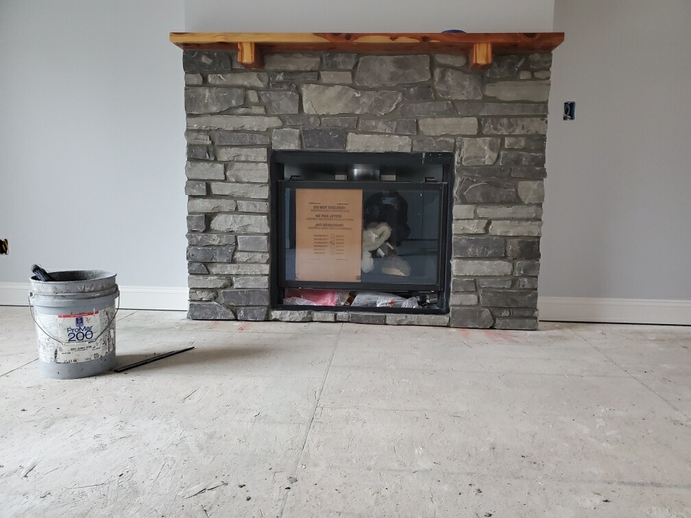 Stone fireplace built by Ramji Construction